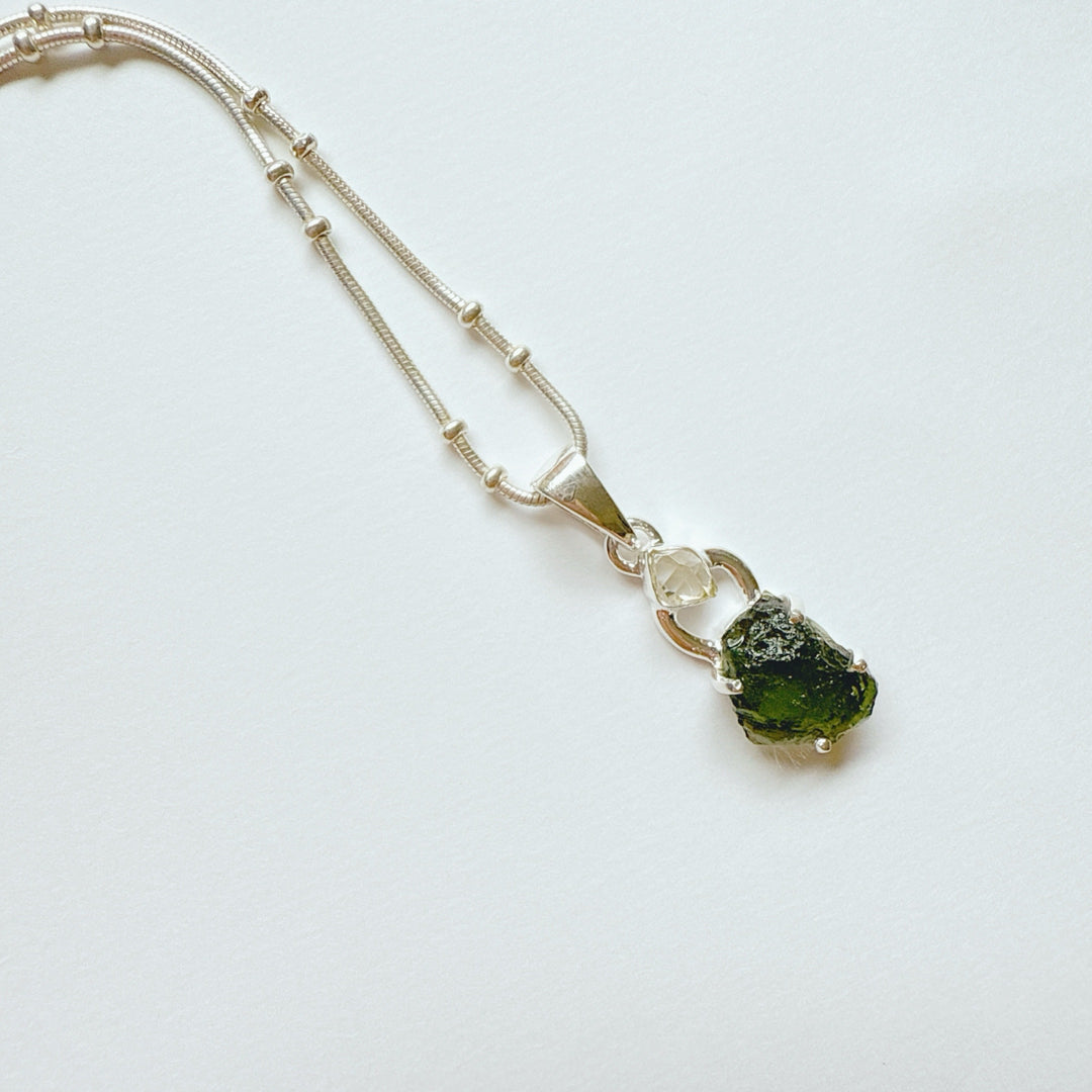 MOLDAVITE & HERKEMIER DIAMOND PENDANT