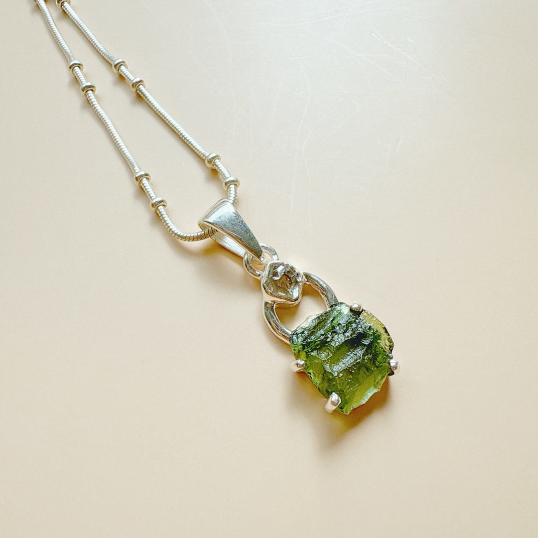 MOLDAVITE & HERKEMIER DIAMOND PENDANT