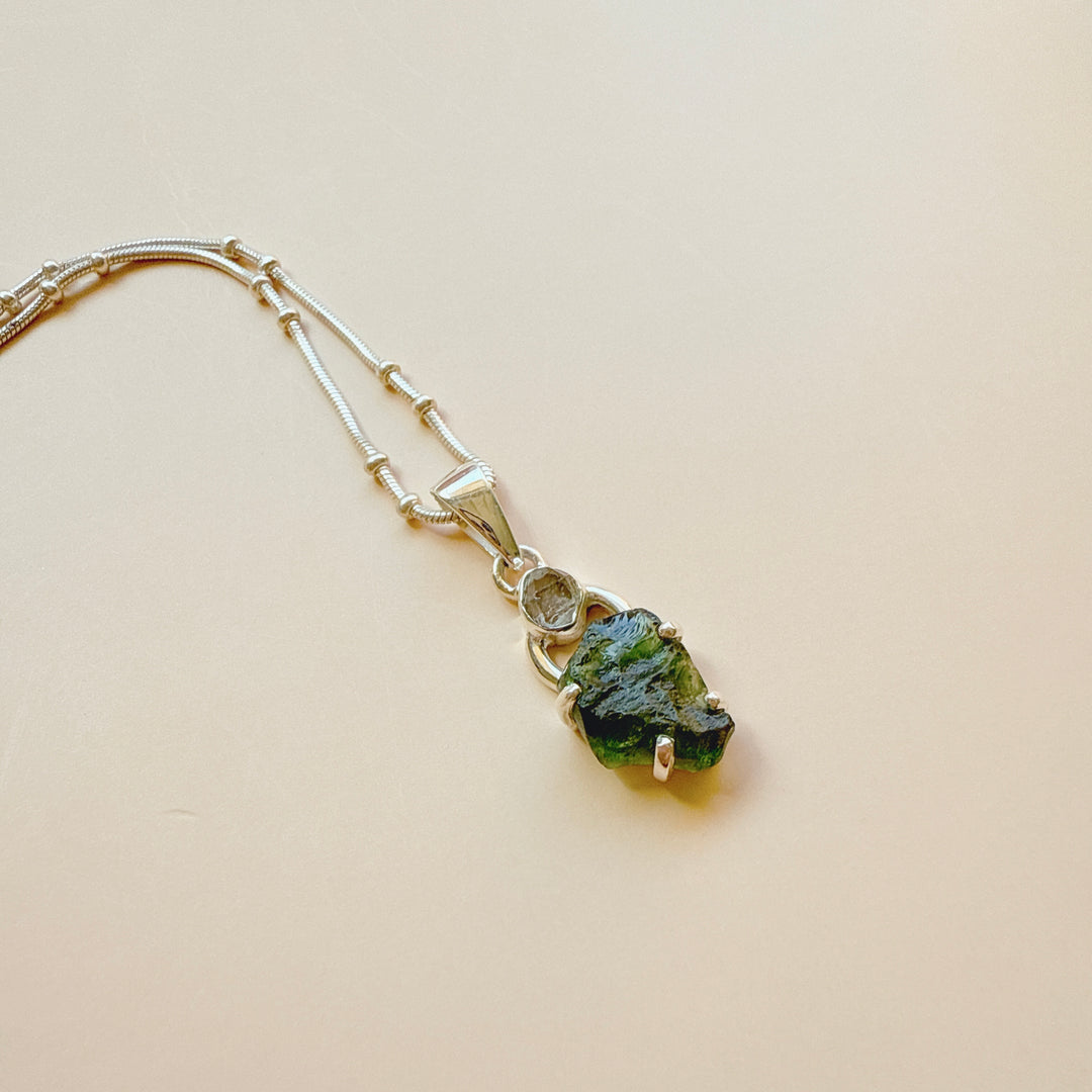 MOLDAVITE & HERKEMIER DIAMOND PENDANT